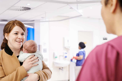 Mother and baby talking to midwife.png